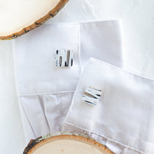 Load image into Gallery viewer, Cufflinks with a birch pattern are styled on the cuffs of a white shirt, against a white background.