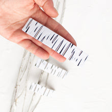 Load image into Gallery viewer, Hand holds a large birch bark polymer clay barrette.